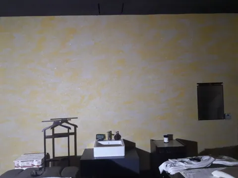Studio wall in yellow and white cloud-pattern cotton plaster