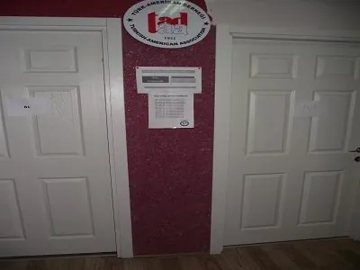 Burgundy cotton plaster wall in a corridor at Türk Amerikan Derneği (Turkish American Association)